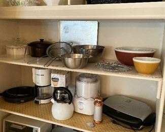 Small appliances: crock pot, blender, waffle maker, George Forman grill, coffee pot; Vintage pyrex mixing bowls; covered pyrex dishes, and non-stick aluminum pans