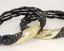 30c - 2 Gold & black bracelets
