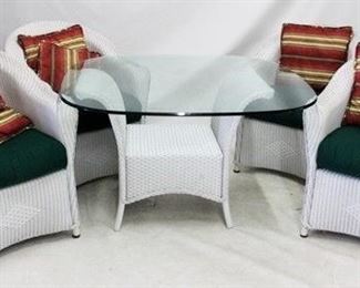 145 - Wicker 5 piece dinette set Heavy glass table top, with pillows table 29 x 48 x 48 chairs 34 x 29 x 30
