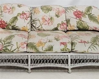 225 - Wicker sofa, floral cushions needs cleaning, has staining 34 x 79 x 30

