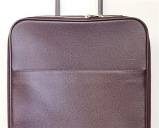 824 - Louis Vuitton carry on rolling suitcase 17 x 14 x 7 tape on handle, damage noted in photos
