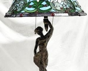 831 - Figural base stained glass lamp - 34" repair to arm
