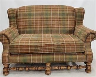 1403 - Schnadig wing back loveseat, carved base plaid upholstery 62 x 31 x 41
