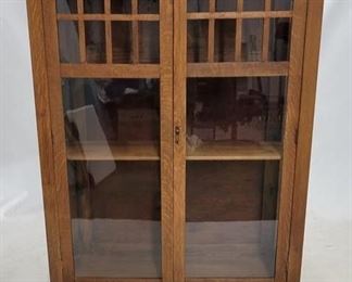 1512 - Mission oak double door bookcase 58 x 40 x 16 little wobbly, missing fretwork bar on side, crack to wood on other side
