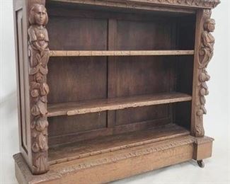 2042 - Heavily carved oak figural adorned bookcase 42.5 x 47 x 13.5

