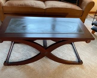 Restoration Hardware solid wood and stone coffee table.  Not sure if it is dark quartz or another stone.  But, it is a one of a kind piece. 