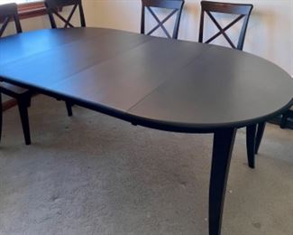 Wood table and 6 chairs with 2 extensions included. 