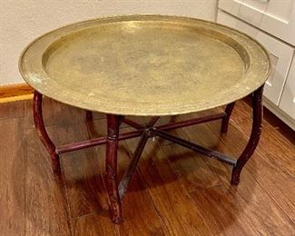 30” brass tray atop foldable wood base…very vintage cool