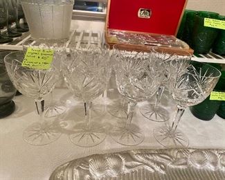 A pretty set of eight heavy cut wine glasses