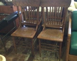 4 oak chairs w/ cane seats (1 seat needs repair)