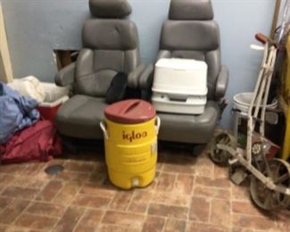 pair of captain's chairs, cooler, camping porta potty, seeder