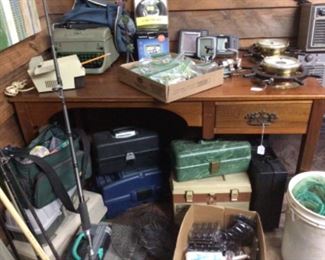 writing desk, lures, tackle boxes