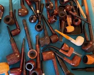 lots of tobacco pipes 