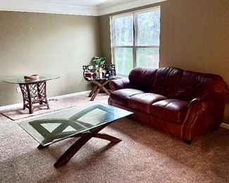 Leather loveseat, modern coffee table, rattan and glass table, modern end table 