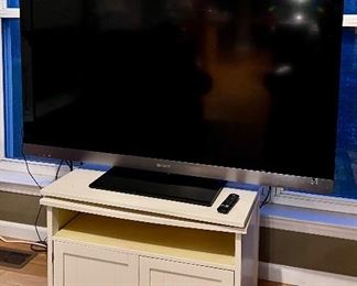 Flat screen, TV, and white cabinet