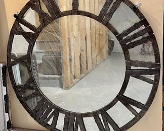 Very large iron Roman numeral wall mirror