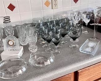 Crystal stemware and clock. Wine glasses and champagne flutes