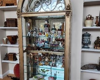 Lighted arch top display case with glass shelves, side and top pull glass doors