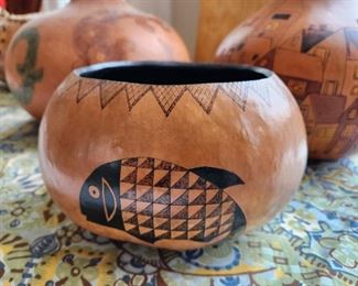 Carved gourd with black fish design