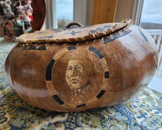 Large Gourd with Indian faces, carved lid