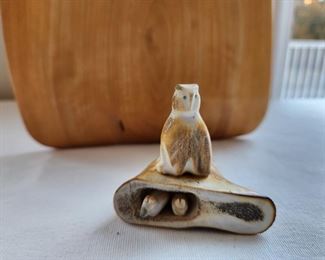 Carved stone bird with her chick