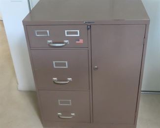Locking file cabinet with locking safe box.