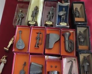 Pewter and metal musical instruments and knights.