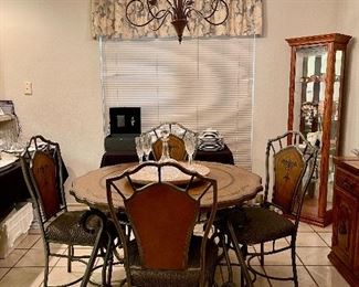 small metal and wood table and four chairs