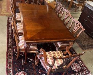 Chippendale style table and eight chairs.