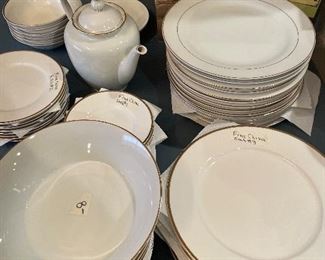 Fine china with gold trim, similar designs. serving dishes. 