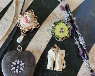 Elephant has gold inlay and precious stones. 