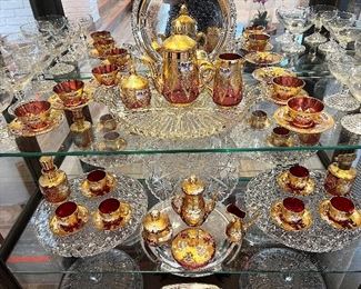 Formal Living/Dining Area~

Kinder Collection Triptych Artwork in a Zentangle Style..
Arteriors Distressed Gold Gilt Driftwood Floor Lamps..
Pair of Golden Faux Driftwood Style Buffet Lamps..
Carved Mahogany Georgian Style Console Table on Trifid Feet..
Double Pedestal Dining Table with 2 Leaves and Pads..
Vintage Japanese Wako China with Platinum Flowers..
Vintage Mosser style and Czechoslovakian Bohemian Cranberry Glassware..
Crystal Hofbaurer Byrdes Pieces..
Assorted Silverplate Serving Pieces..
Vintage Etched Glassware in Florals or Grapes..
Tufted Damask Ivory Sofa with Pleated Skirt Details..
Craftwork Gild fully reclining Wingback Chair with Brass Nailhead details..
Porter Designs Lakewood Lift Top Solid Acacia Wood Coffee Table..
Garrett Glass Front Cabinet from Pottery Barn..
Metallic Longhorn Skull on lighted Stand..