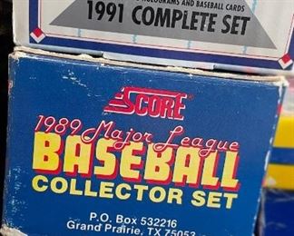 1990 Score football cards, 1991 Topps Football set, 
1990 Fleer baseball factory set: unsealed, 1989 Score baseball cards: unsealed factory set, 1991 Upper Deck baseball factory set: used, 1991 Donruss baseball factory set: unsealed