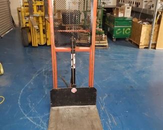 This is a Presto lift.  It operates with a hydraulic foot pump.  Great for lifting heavy items without a large forklift.  This sells on ULINE for $2,250 new.  I will sell mine to you for $400