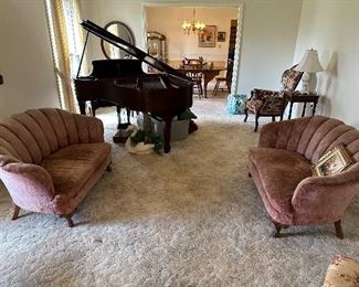 Living room with grand piano, and Napoleon loveseats