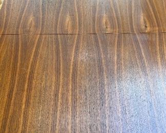 Mid Century Modern walnut dining set with four chairs attributed to Adrian Pearsall.  This set has one leaf and full table pads