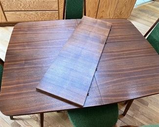 Mid Century Modern walnut dining set with four chairs attributed to Adrian Pearsall.  This set has one leaf and full table pads