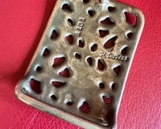 1970’s brass belt buckle by K. DuPree, marked