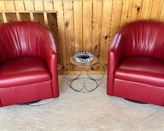 Two Natuzzi ‘Giada’ red leather swivel chairs