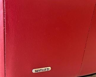Two Natuzzi ‘Giada’ red leather swivel chairs