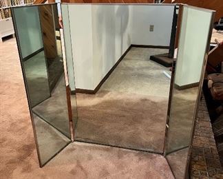 Amazing vintage condition NuTone three-panel mirror Model 1050 SS.  This piece is designed to be able to hang on a wall