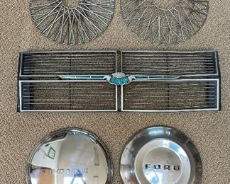 Grill from a 1969 Ford Thunderbird Landau and a selection of mostly 1950’s hubcaps & wheel covers