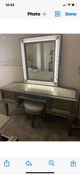 Make up table lights up 51 x 21 1/2 x 68. The mirror is 43 1/2 x 32 1/2.