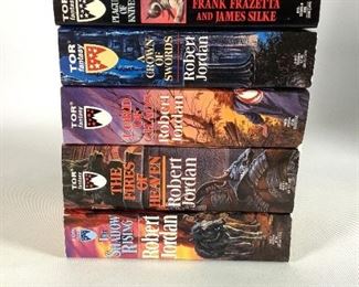 Five (5) Fantasy Paperback Books: Robert Jordan's "The Wheel of Time" Series, books 4-7, Frank Frazetta's "Death Dealer - Book 4 - Plague of Knives". Used but in overall good condition.