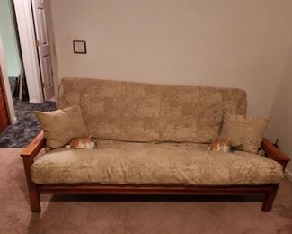 Wood frame futon with mattress.  Very good condition.