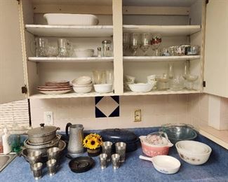 Kitchenware, including Pyrex mixing bowls in Gooseberry and Town & Country patterns.  One 6 1/2" Corningware skillet in Blue Cornflower pattern, one Corningware rectangular casserole dish in French White.  Depression era aluminum Guardian Service ware.  Vintage Vogel Gutezinn large and small pewter cup sets.