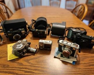 Selection of vintage cameras- Minolta, Canon, Polaroid and Revere
