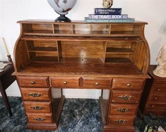 Roll top desk shown with top retracted.