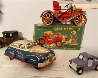 Antique Tin Litho Auto With Lever Action Motor by Modern Toys In Original Box, Antique 1940’s Walt Reach Courtland Wind-Up Police Car, Vintage Model T Cast Iron Car
