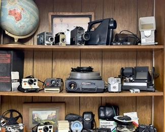 Vintage Globe, Old Webster Dictionary, Vintage Camera Collection-Brownies, Poloroids, Kodak, Mansfield Reporter 8mm Editor, Kodak Carousel , Kodak Video Camera